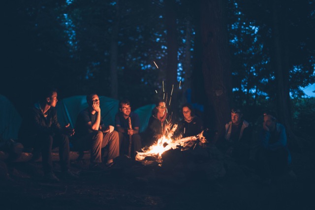 if you find yourself wondering what is creative copywriting consider it as storytelling like these people around a campfire