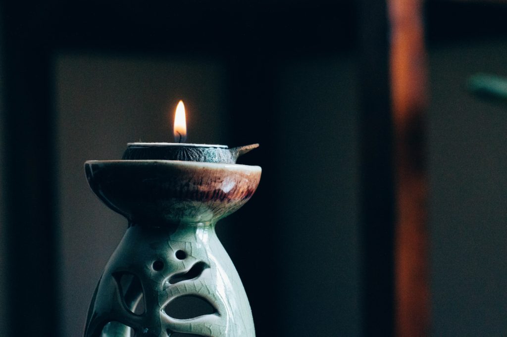 Candle set aside for motivational meditation session 