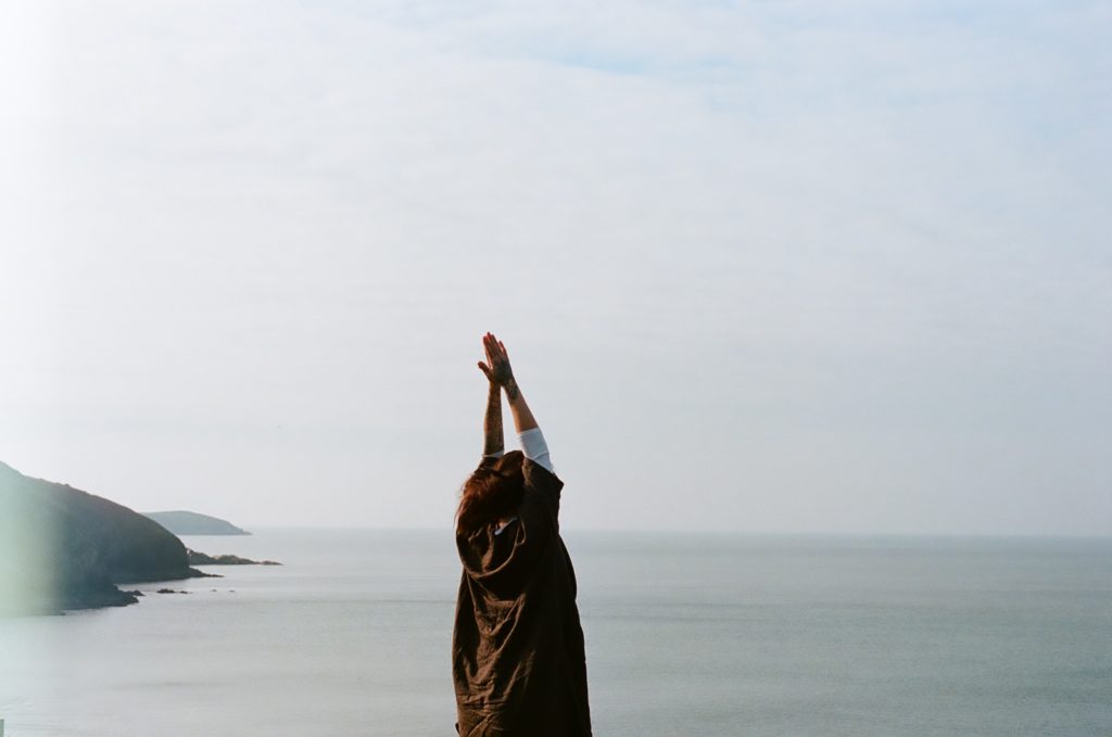 Person spends a moment in meditation and yoga to align, motivate and inspire 