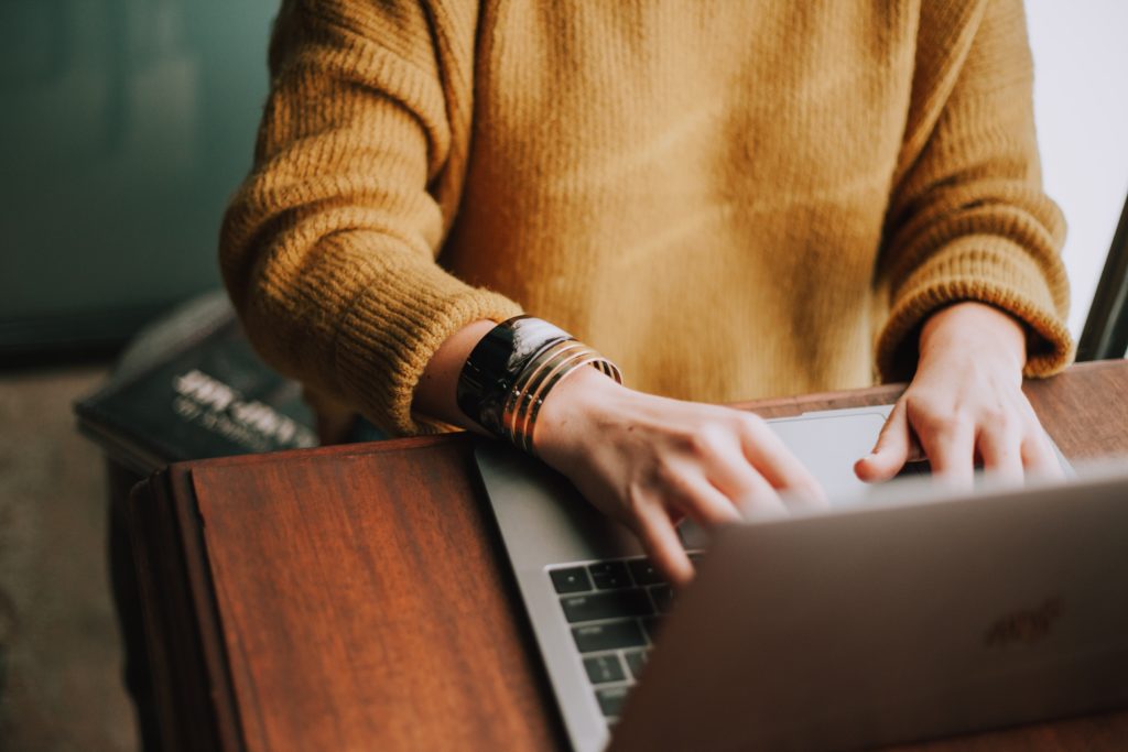 Woman drafting her website copy on her laptop 