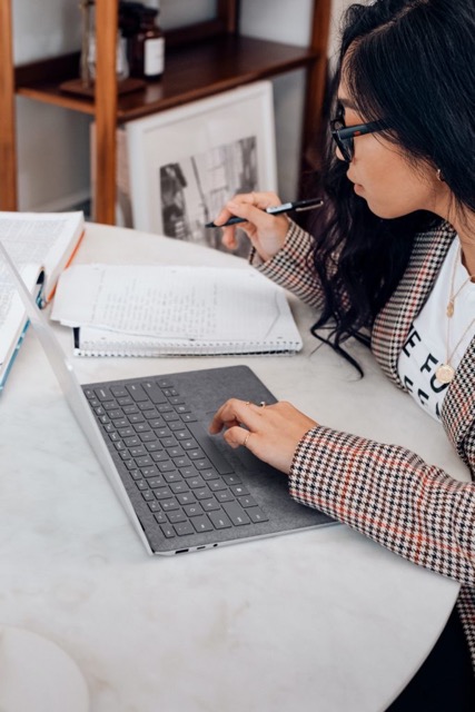 Woman using her computer to study her vocabulary 