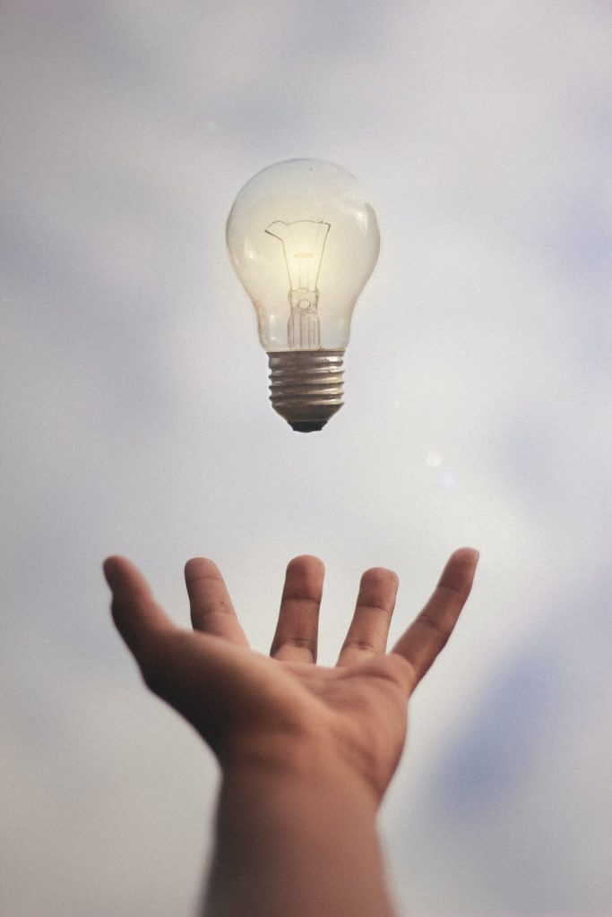 image of hand and lightbulb to illustrate a powerful idea