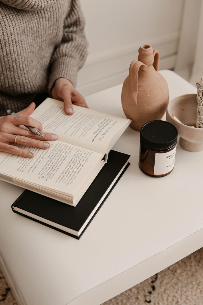 woman using journal prompts