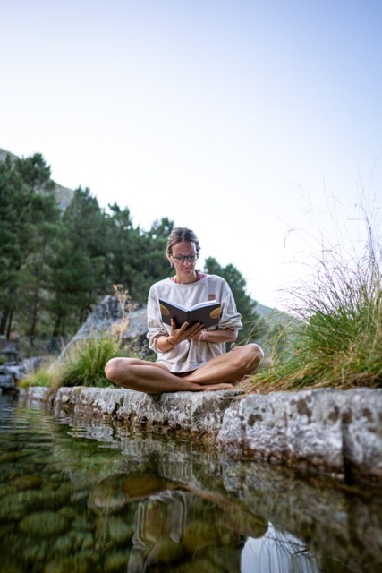 Woman reading what she has written in her journal 