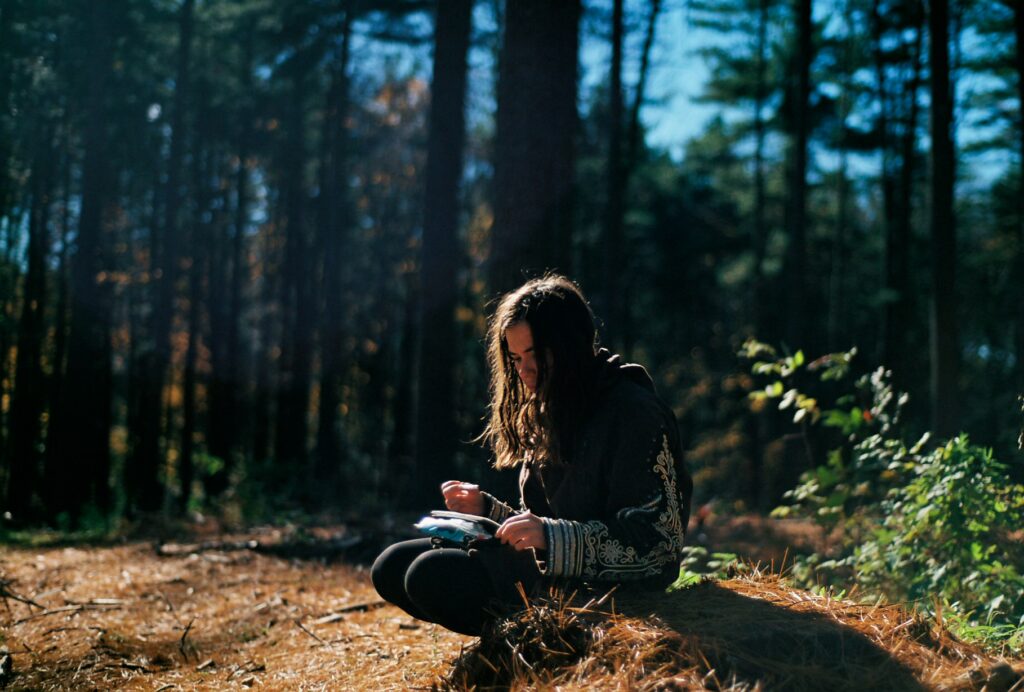 Woman writing in her gratitude journal 