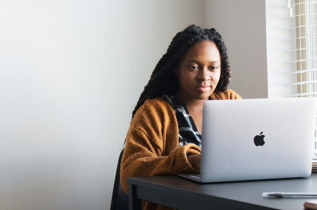 woman writing her sale copy for her small business 