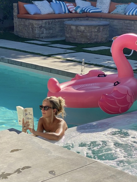A projector at ease in her own company, reading a book 