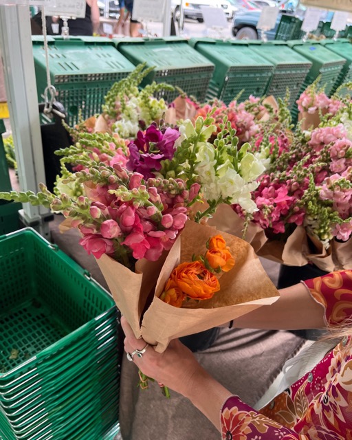 A reflector buying herself flowers to make her environment feel more beautiful for her spring reset 