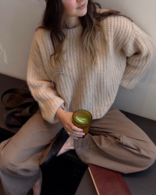 Woman checking in with herself and her energetic capacity for the day to prevent burnout 
